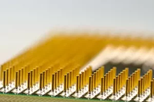 Extreme close-up of gold CPU processor pins
