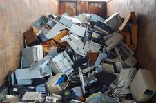 A pile of discarded e-waste devices containing neurotoxins